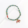 human trafficking fair trade jewelry green and red bracelet